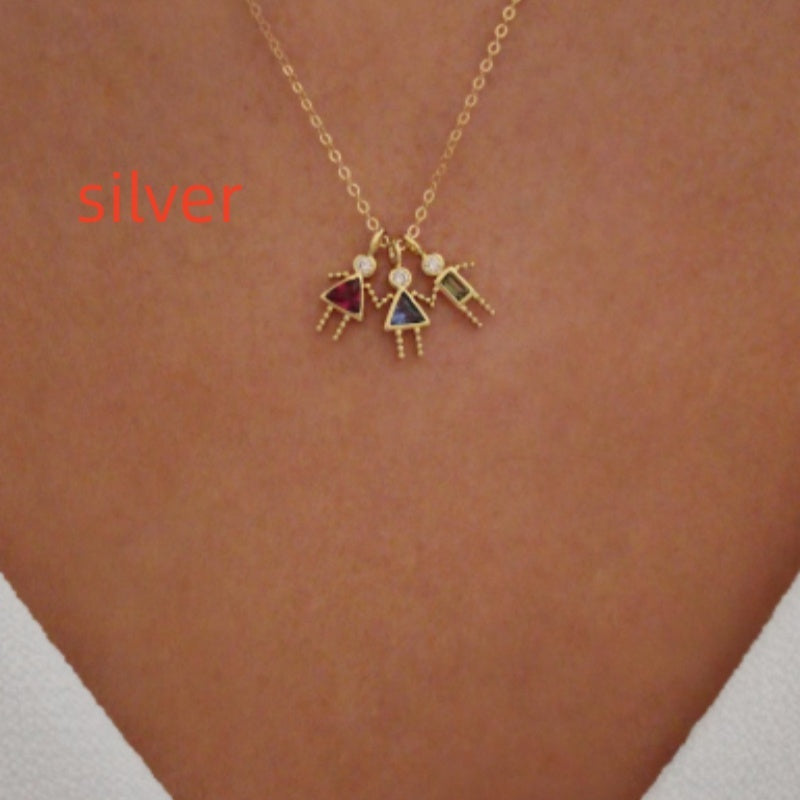 Twelve zodiac stone pendants in gold featuring colorful girl figures on a chain necklace.