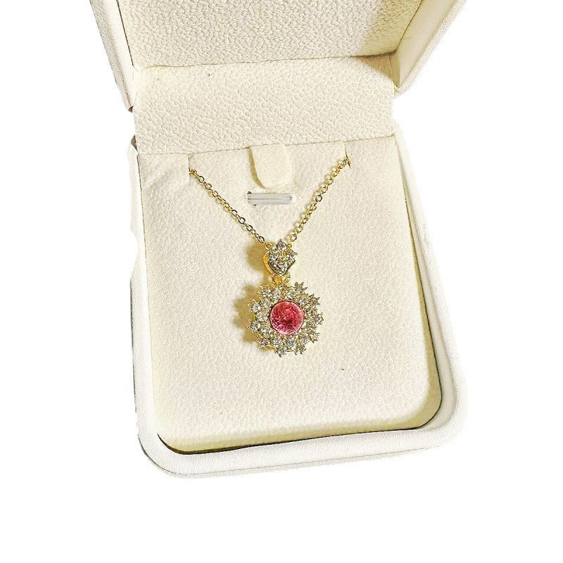 Women's Pomegranate Red Rings Pendants Earings Set displayed with necklace, earrings, and ring in gold and red design.