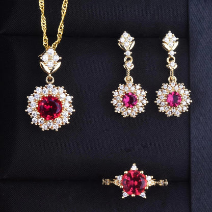Women's Pomegranate Red Rings Pendants Earings Set displayed with necklace, earrings, and ring in gold and red design.